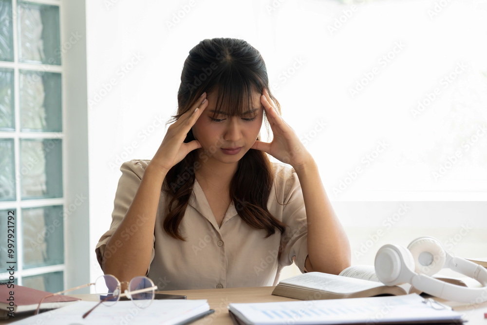 Young woman stressed while studying or project work. Young woman stressed while studying or project work.