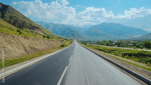 A concrete auto road winding through the Almaty region in Central Asia, Kazakhstan.