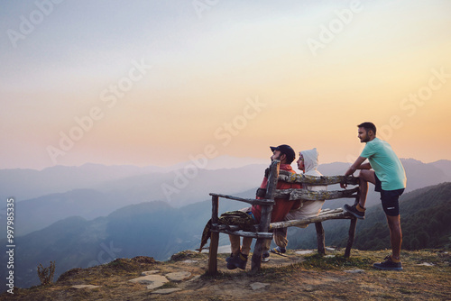 Three young friends enjoy in  Sainj Valley Himachal Pradesh India. photo