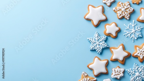 Festive sugar cookies with icing on a blue background for the holidays
