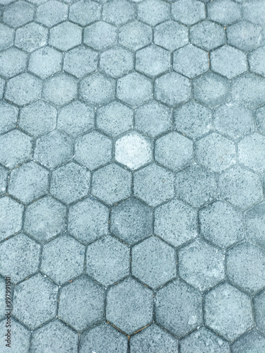 A path that people often walk on. Hexagonal floor tiles. Selective focus.
 photo