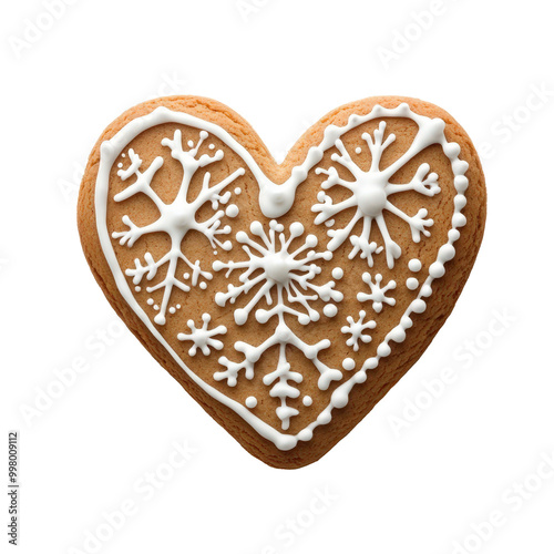 Heart-shaped Christmas cookie with intricate snowflake icing design