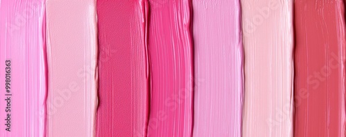 Close-up of creamy Cool Pink lipstick swatches, smoothly blended in various shades from soft pink to bold, bright pink. photo