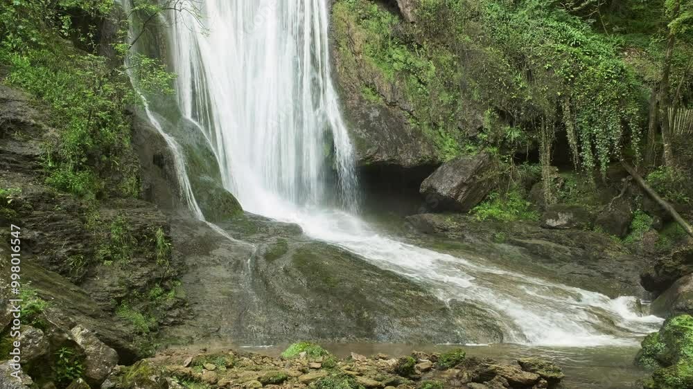 The Cascade d'Autoire waterfall in summer. A 30 meter high waterfall near Autoire in Lot Occitanie Southern France The Cascade d'Autoire waterfall in summer. A 30 meter high waterfall near Autoire in Lot Occitanie Southern France