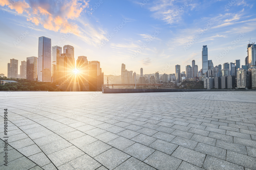 Empty square floor and city skyline with modern buildings scenery at sunrise in Chongqing. car advertising background. Empty square floor and city skyline with modern buildings scenery at sunrise in Chongqing. car advertising background.
