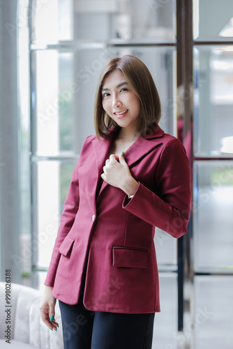 Young female politician or lawyer making an oath with hand on heart and chest .