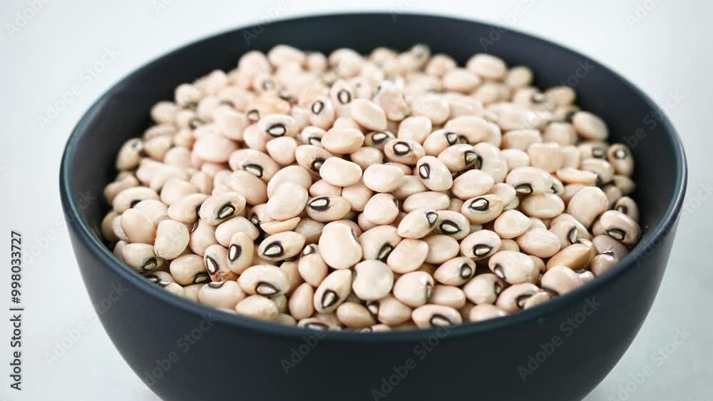 Filling black eyed peas in a bowl. Filling black eyed peas in a bowl.