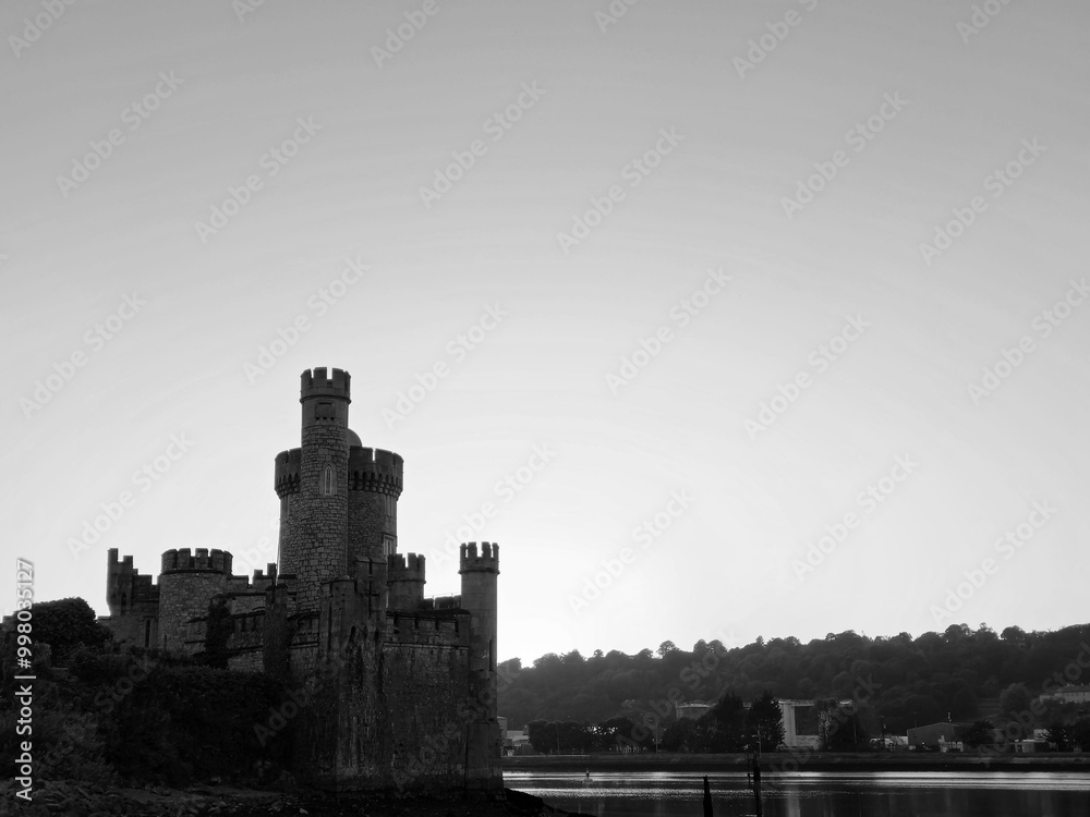 Blackrock castle observatory silhouette in the rays of sunset sun black and white monochrome background Blackrock castle observatory silhouette in the rays of sunset sun black and white monochrome background