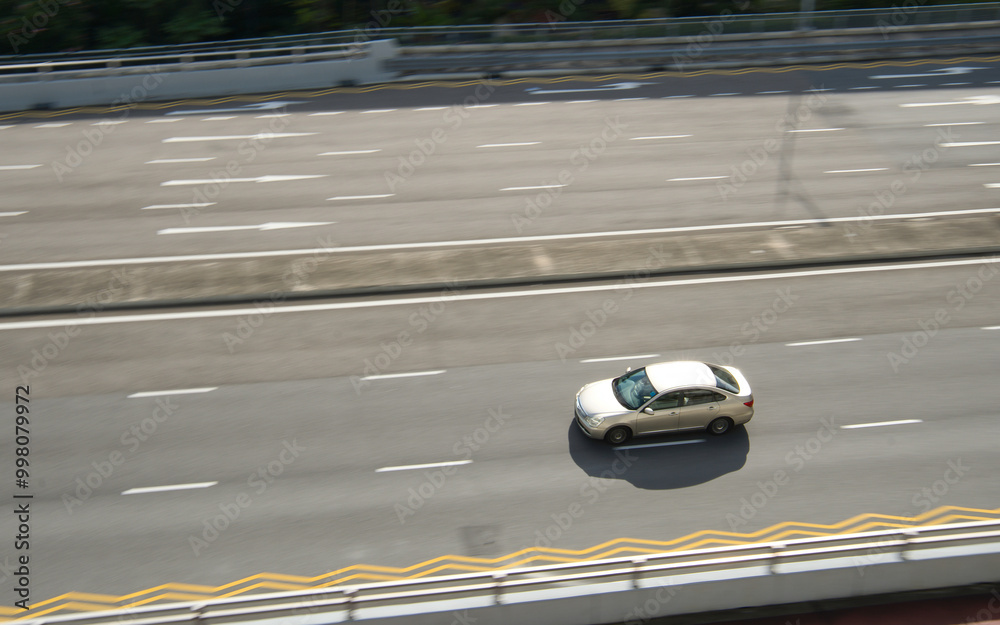 Fototapeta premium Silver sedan car on highway.
