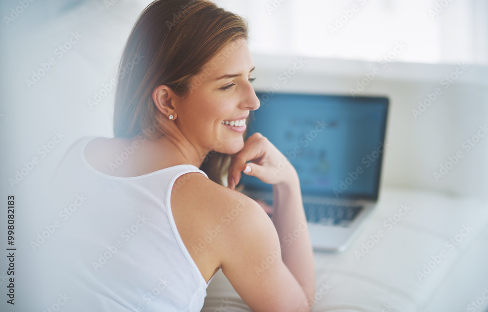 Laptop, smile and thinking with woman on sofa in living room of home for online shopping or research. Computer, ecommerce and idea with happy person in apartment as customer for retail browsing