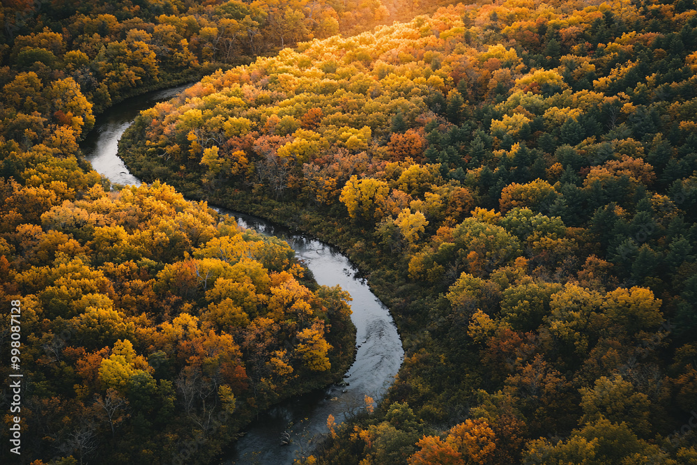 aerial view of winding river through fall foliage forest aerial view of winding river through fall foliage forest