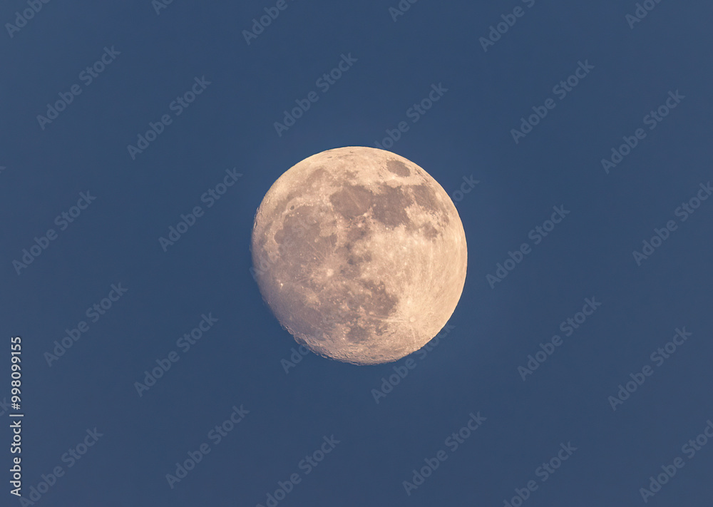 Full moon close up on blue sky background Full moon close up on blue sky background