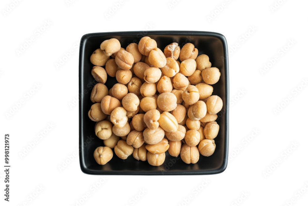 Roasted peeled Hazelnuts in black bowl isolated on background, edible dried nut that rich in nutrients for health. Roasted peeled Hazelnuts in black bowl isolated on background, edible dried nut that rich in nutrients for health.