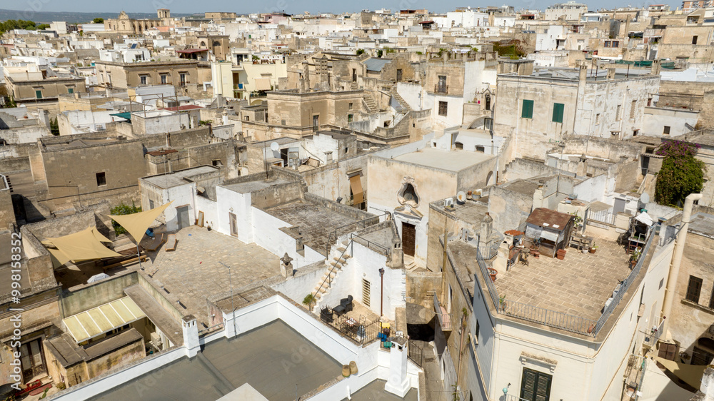 Aerial view of houses, apartments and buildings in the historic center of Grottaglie. It is a city in the province of Taranto, in Puglia, Italy. Aerial view of houses, apartments and buildings in the historic center of Grottaglie. It is a city in the province of Taranto, in Puglia, Italy.