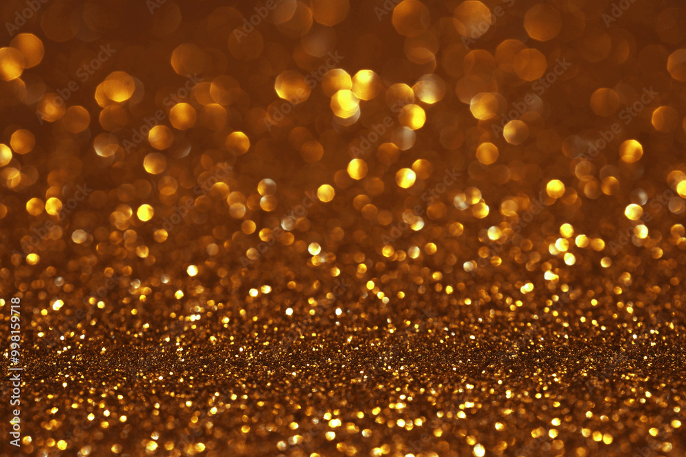 Golden glitter festive bokeh background, abstract defocused texture. Holiday lights