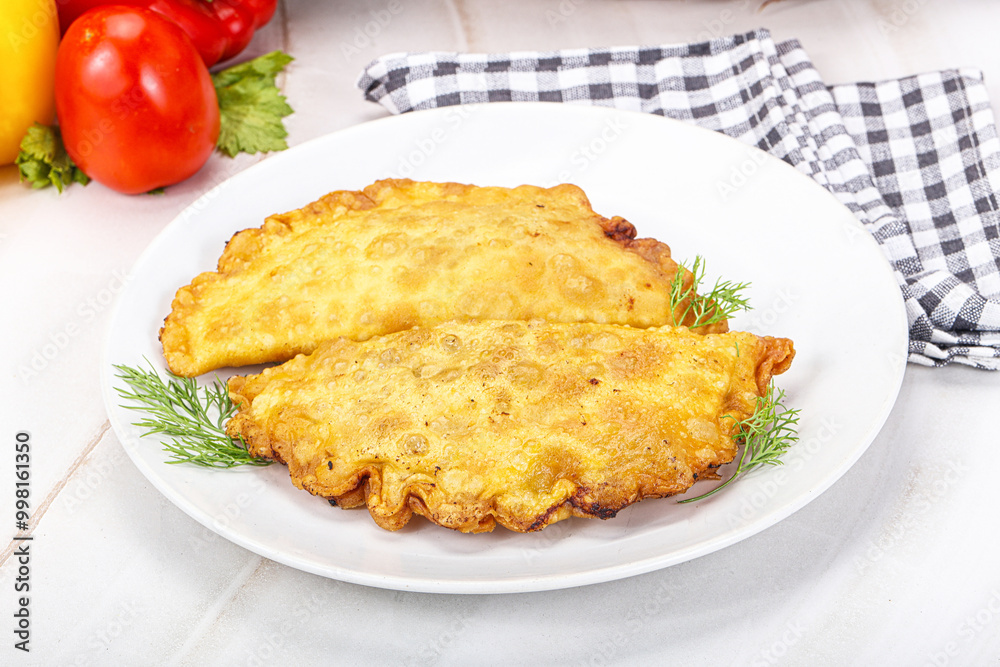 Homemade fried cheburek with meat Homemade fried cheburek with meat