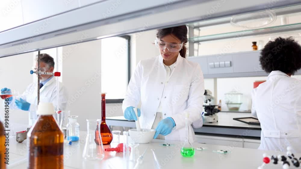 Lab specialists working at the lab and examining some samples Lab specialists working at the lab and examining some samples