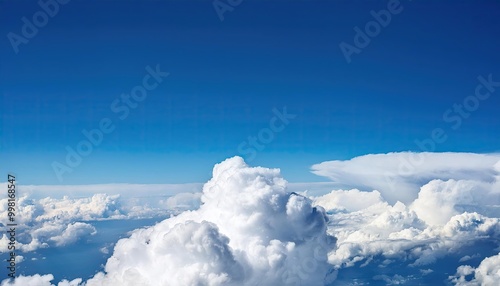Fototapeta Naklejka Na Ścianę i Meble -  bright cloudy sky view from airplane. White clouds on blue sky background close up, cumulus clouds high in azure skies, beautiful aerial cloudscape view from above.