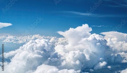 Wallpaper Mural bright cloudy sky view from airplane. White clouds on blue sky background close up, cumulus clouds high in azure skies, beautiful aerial cloudscape view from above. Torontodigital.ca