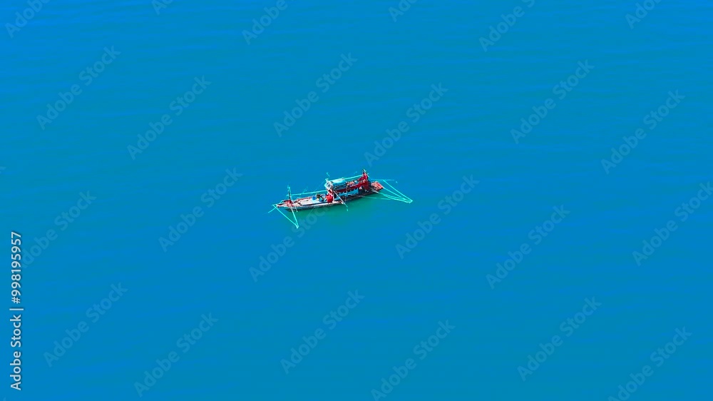 Top view of a fishing boat sailing. Asian fishing boat at sea. Top view of a fishing boat sailing. Asian fishing boat at sea.