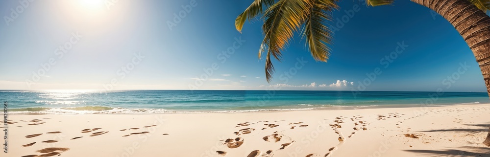 A serene tropical beach scene features a clear blue sky, a warm sun casting a golden glow, a sandy beach with footprints, a calm ocean, and a palm tree, creating a tranquil and picturesque atmosphere A serene tropical beach scene features a clear blue sky, a warm sun casting a golden glow, a sandy beach with footprints, a calm ocean, and a palm tree, creating a tranquil and picturesque atmosphere