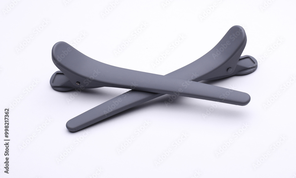 Fototapeta premium Plastic clothespins on a white background