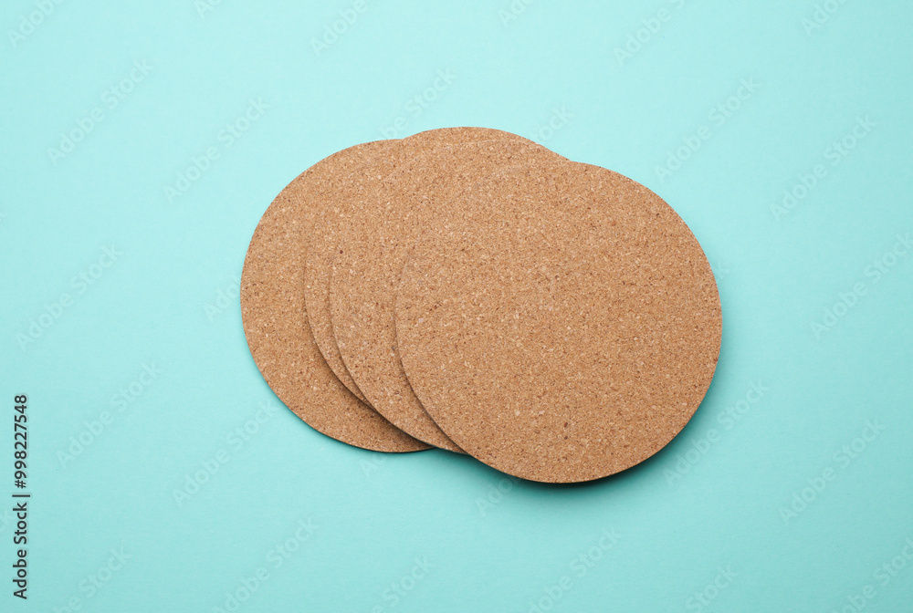 Cork coasters for drinks on a blue background Cork coasters for drinks on a blue background
