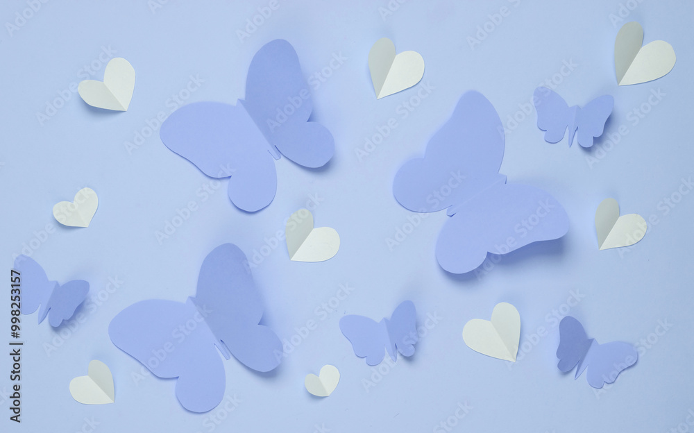 Butterflies and hearts cut out of paper on pastel background. Spring background, love concept. Creative layout Butterflies and hearts cut out of paper on pastel background. Spring background, love concept. Creative layout