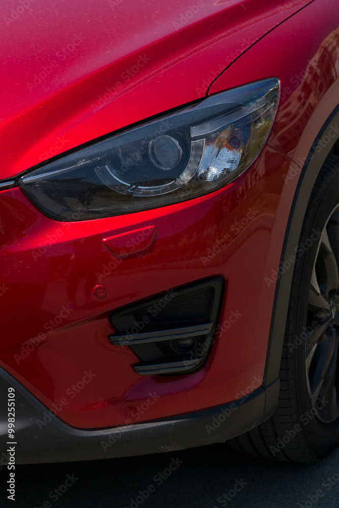 Leftist front wheel and headlight. Replicas of Russian cars. Halogen lighting at the red car. Leftist front wheel and headlight. Replicas of Russian cars. Halogen lighting at the red car.