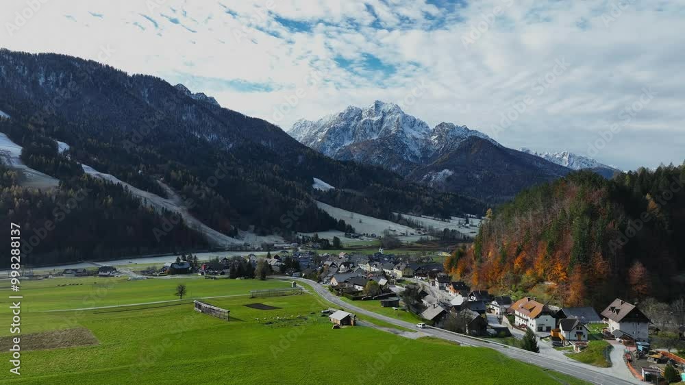 The roadway with mountain village environs, grassy hills. Picturesque traveling, seasonal at countryside The roadway with mountain village environs, grassy hills. Picturesque traveling, seasonal at countryside