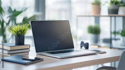 Modern Workspace with Laptop and Books