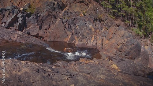 A waterfall in the rocky canyon of an ancient fossil volcano.