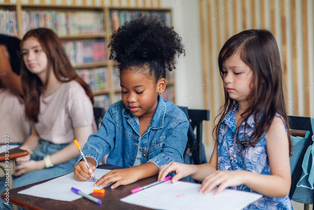 Girl is study in the Classroom. Back to school! Cute industrious children are sitting at desks indoors. Kids are learning in class. Girl is study in the Classroom. Back to school! Cute industrious children are sitting at desks indoors. Kids are learning in class.