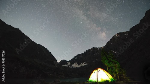 timelapse of the starry sky above a tent on Lake Kuyguk in Altai photo