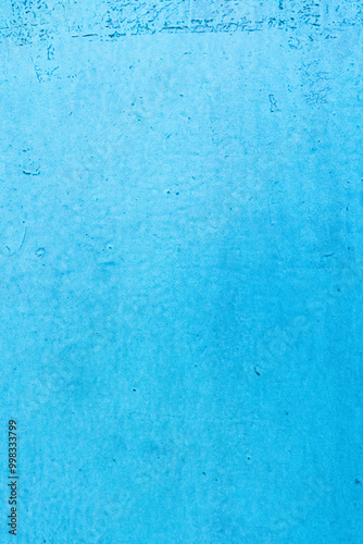 A vibrant blue textured background with a rough, grunge surface. Ideal for design projects, backdrops, and creative visual elements. Offers a minimalist yet striking appearance.