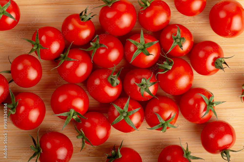 Cherry tomatoes on a wooden cutting board Cherry tomatoes on a wooden cutting board