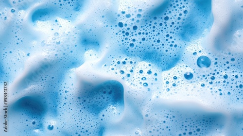 Natural soap foam texture with a light blue hue creating a clean and pure background ideal for themes related to cleanliness and washing photo