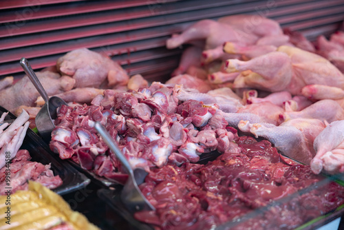 Fresh poultry, chicken thighs, chicken stomachs, kidneys for cooking or roasting. Raw meat, meat products and fresh. Haagse Market in The Hague, Netherlands.