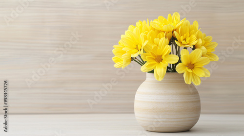 Wallpaper Mural A bouquet of yellow flowers in a beige vase against a woodgrain background. Torontodigital.ca