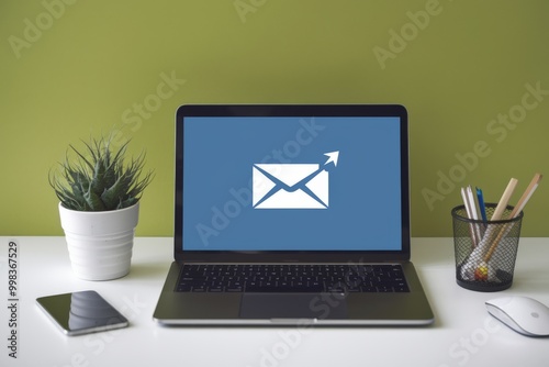 Email icon on laptop screen, technology and message concept. photo