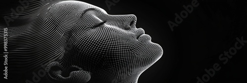 A monochromatic wireframe representation of a human face in profile view, set against a dark background, illustrating the fundamentals of digital design and 3D modeling. photo