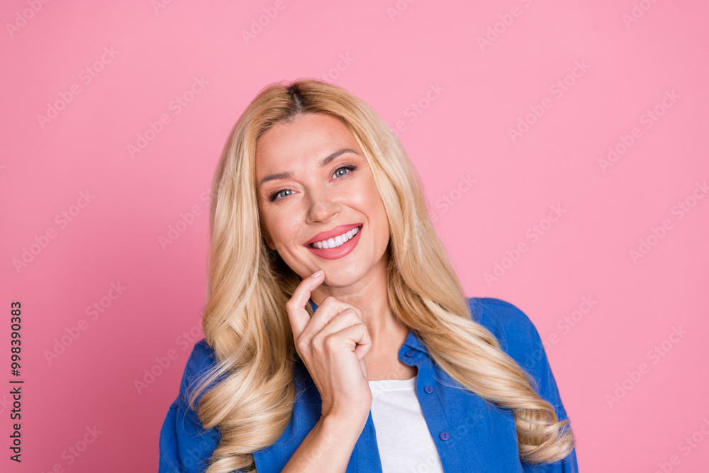 Photo of charming dreamy woman wear blue shirt arm chin empty space isolated pink color background Photo of charming dreamy woman wear blue shirt arm chin empty space isolated pink color background