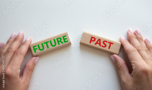 Future or Past symbol. Concept word Future or Past on wooden blocks. Businessman hand. Beautiful white background. Business and Future or Past concept. Copy space