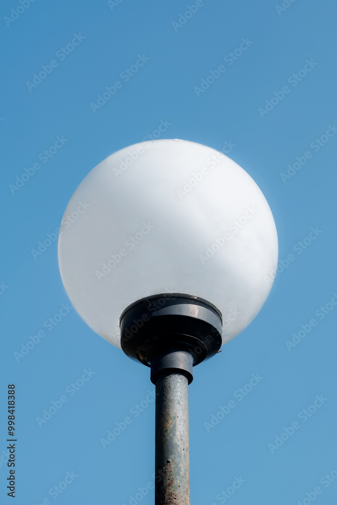 round garden lamp with blue sky background round garden lamp with blue sky background