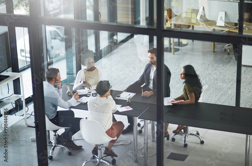Business people, meeting and above with teamwork in office, talk and feedback for project. Employees, consultant or coworkers with review, communication or development for company and brainstorming