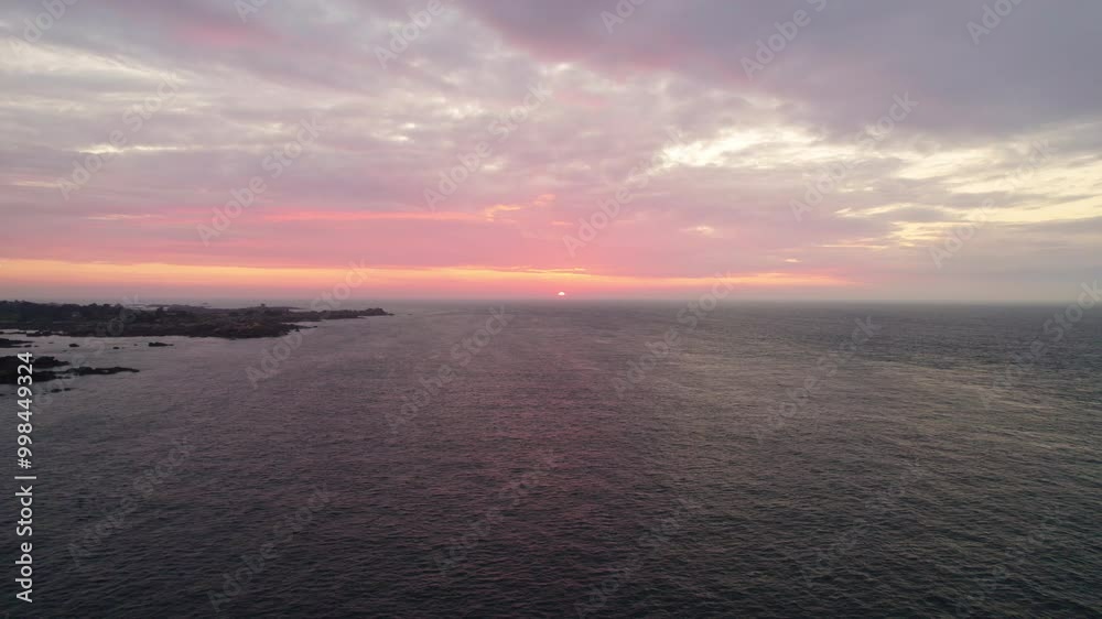 Aerial view of sunset landscapes over the sea along the coastline of the Pink Granite Coast in Brittany, France