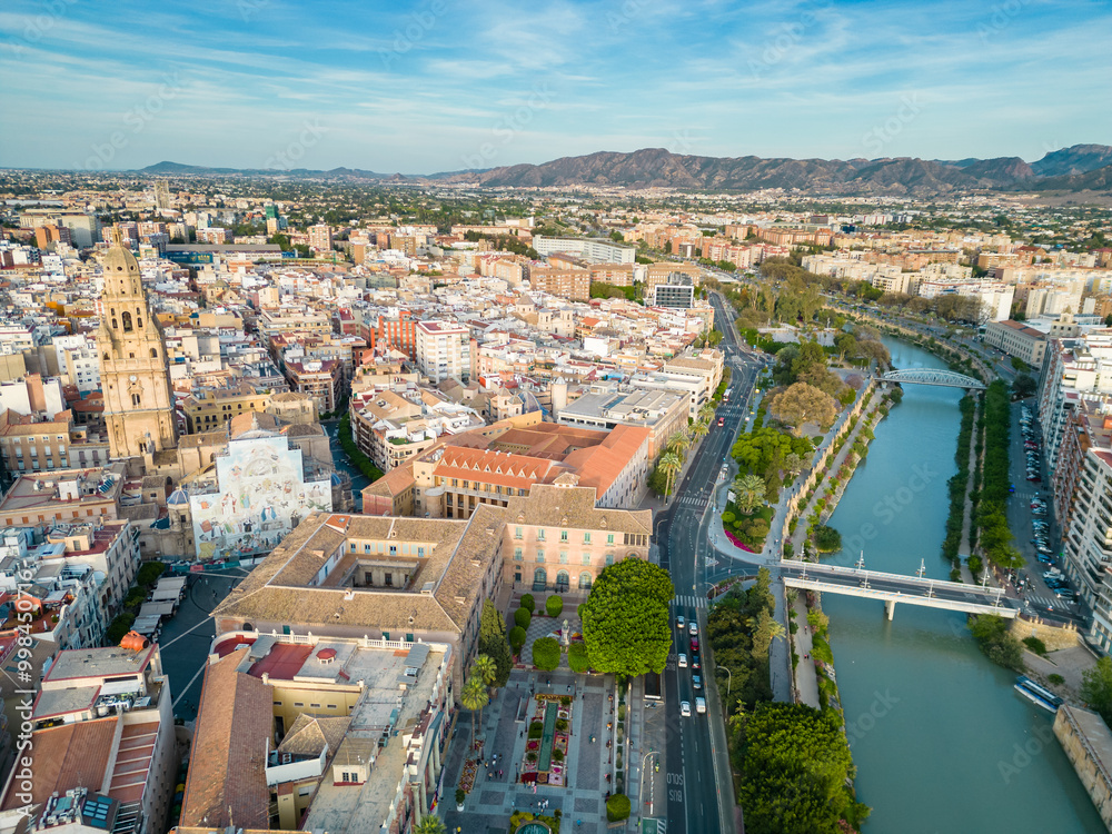 Obraz premium Aerial perspective of old town center of Murcia. Rooftops of Murcia. Medieval and historic travel destination in Spain. View of Cathedral of Murcia. River Segura 