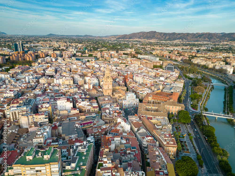 Obraz premium Aerial perspective of old town center of Murcia. Rooftops of Murcia. Medieval and historic travel destination in Spain. View of Cathedral of Murcia. River Segura 