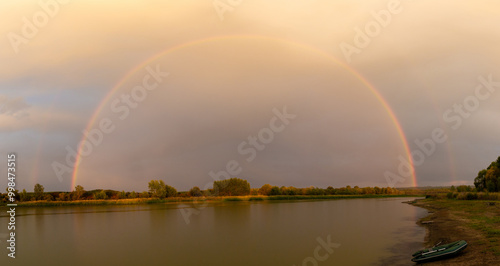 Landscape with a rainbow over the lake