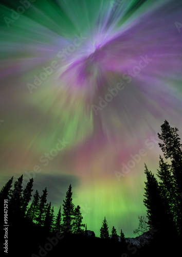 Aurora borealis filling sky with green and purple lights